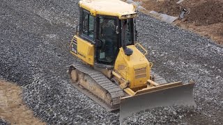 Komatsu D37EX-22 spreading gravel part 3 (a view from above)