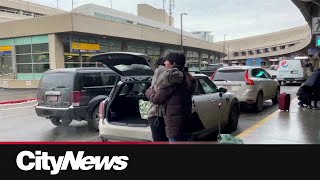 Parting ways after the holidays with emotional goodbyes at the Calgary International Airport