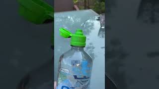 Water Bottle With Green Top Squirts Water