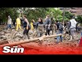 Colombia landslide Live: Rescuers search through mud for survivors