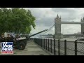 Queen Elizabeth honored with 96-gun salute