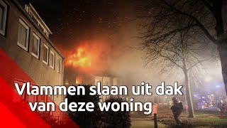 Vlammen slaan uit dak van woning in Vlijmen