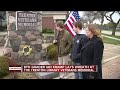 8th grader Ian Kram lays wreath at Trenton Library Veterans Memorial