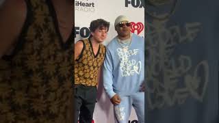 Charlie Puth and LL Cool J meeting on 2022 iHeart Radio Awards Red Carpet