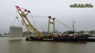 Emden Port construction site heavyload crane ship ENAK inserts sealock door Nesserland timelapse