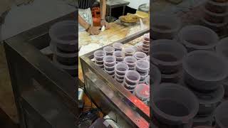 A master dumpling restaurant owner roll out dumpling wrappers 饺子店老板擀饺子皮Jiangxi，China Sep 2023