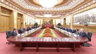 President Xi Jinping holds talks with Putin in Beijing
