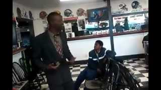 Guy in Fatheadz barbershop singing his pain