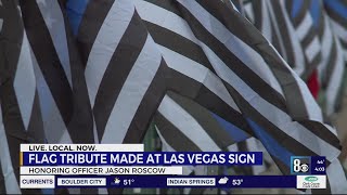 Flag memorial at 'Welcome to Las Vegas' sign honors fallen police officer