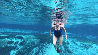 @TrinaMason super happy swimming in the water head above water underwater mask fun fins