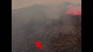 Man runs over glowing lava flow on volcano in Iceland