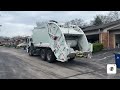 White Waste connections Mack LR McNeilus rear loader packing trash