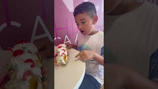 Mason having his very first banana split at Baskin Robbins