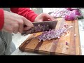 horizontal swipes on onions with Chinese cleaver