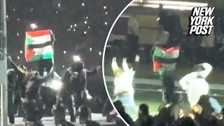 Super Bowl 2025 halftime show performer waves Palestinian, Sudanese flags, apprehended by security