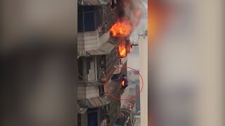 Man hangs out of 23rd floor window to escape blazing apartment