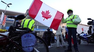 'Freedom Convoy' supporters in France carry Canadian flags