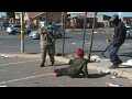 South African army patrols Soweto streets to deter looters | AFP