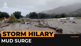 Mud and debris surges up from underground after California storm