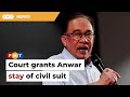 Anwar allowed stay of civil suit by ex-research assistant