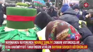 Bakıda Novruz şənliyi zamanı vətəndaşlar bayram sovqatı götürüblər.