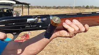 Slow motion semi-auto 12 gauge shotgun shooting