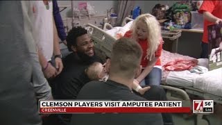 Clemson players visit baby amputee in Greenville