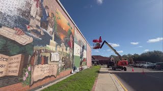 Two William Carey students working on largest mural in Hattiesburg