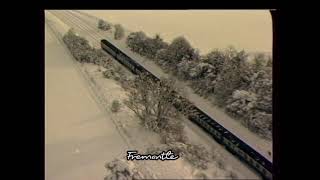 Train travelling in the snow  Aerial footage |1980s Train | 1980s UK |Snowy Landscape |TN-SL-100-021