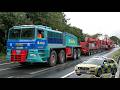 Very heavy 706 tonne transport with 280 wheels squeezes through tight bend as police shut roads