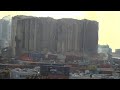 Beirut's blast-damaged grain silos partially collapse | AFP