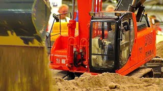 RC CONSTRUCTION SITE WITH AMAZING DETAIL EXCAVATOR O\u0026K RH 6.6 AT THE HARD WORK