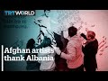 Afghan refugees paint mural to thank Albanians for hospitality