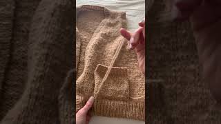 Sewing on pockets in knitting