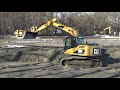 excavators in the mud bagry v bahnĚ revitalizace rybníků bažina a domin.