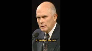 Carjacker holds Elder Oaks at gunpoint.