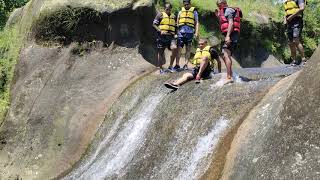 Sliding in small river trekking, mawlyngbna, Meghalaya