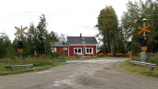 Intercity Ic 73 passed PITKÄAHO level crossing in Mikkeli, Finland