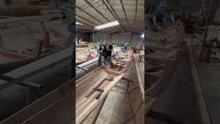 Craftsmen are making wooden boats