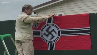 Woman drops suit over man's nazi signs