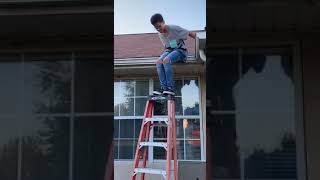 Kid Shatters Glass Window by Knocking Over Ladder from Roof - 1076083