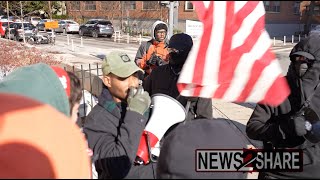 Protester with American flag confronts anti-Trump \