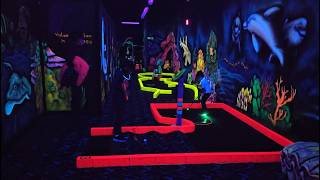 Playing 3D Blacklight Mini Golf. \