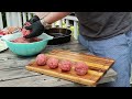 smash burgers in a cast iron skillet