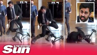 Hilarious moment Humza Yousaf falls off his scooter in Holyrood corridor