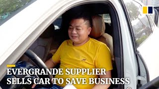 Unpaid by Evergrande, supplier sells car and home to rescue his business