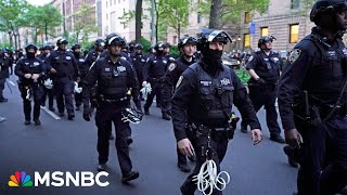 NYPD officers in full riot gear descend on Columbia University campus to clear protesters