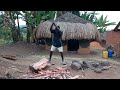 african village life splitting firewood uganda village life style