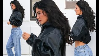 Kylie Jenner shows off her VERY slim waist in faded jeans and leather jacket after girls' night