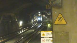 Montreal metro train coming in from the tunnel